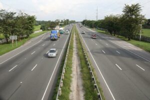 Image of a highway with some cars