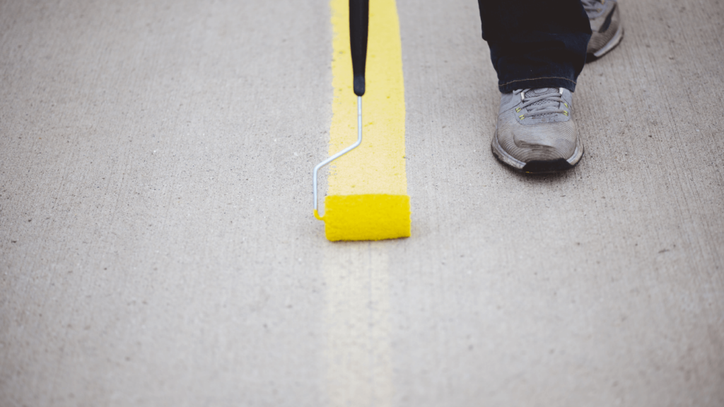 guy painting road