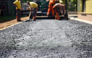 workers layering the asphalt