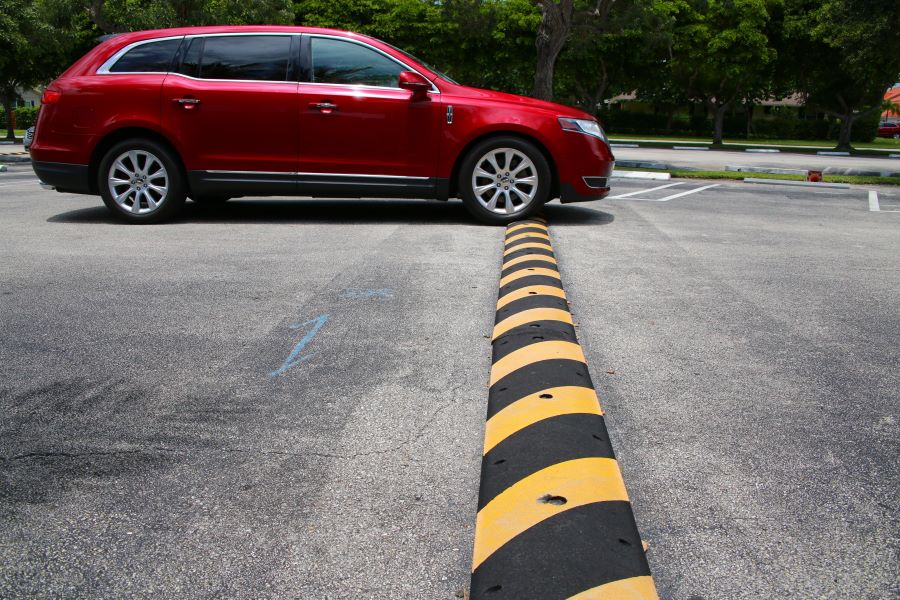 car driving over a road hump