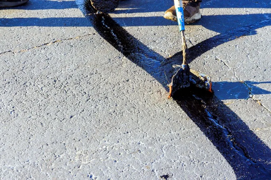 asphalt sealing of road crack